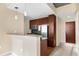 Modern kitchen with dark wood cabinets and granite countertops at 155 S Court Ave # 1804, Orlando, FL 32801