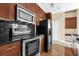 Modern kitchen with stainless steel appliances and granite countertops at 155 S Court Ave # 1804, Orlando, FL 32801