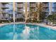 Stunning community pool reflecting building exterior at 155 S Court Ave # 1804, Orlando, FL 32801