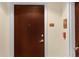 Modern condo entry with dark brown door and updated hardware at 155 S Court Ave # 1804, Orlando, FL 32801
