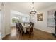 Elegant dining room with hardwood floors and large table at 3052 Cardillino Way, Kissimmee, FL 34741