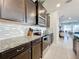 Modern kitchen with dark wood cabinets and granite countertops at 8914 Zurich Ln, Kissimmee, FL 34747