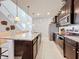 Open concept kitchen with island and stainless steel appliances at 8914 Zurich Ln, Kissimmee, FL 34747
