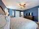Main bedroom with king bed, dresser, and TV at 8914 Zurich Ln, Kissimmee, FL 34747