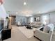 Spacious bonus room with plenty of seating and a TV at 8914 Zurich Ln, Kissimmee, FL 34747