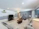 Spacious game room featuring comfortable seating and a large TV at 8914 Zurich Ln, Kissimmee, FL 34747