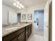 Double vanity bathroom with granite countertop at 8914 Zurich Ln, Kissimmee, FL 34747