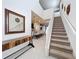 Bright and airy entryway with a staircase leading to the second floor at 8914 Zurich Ln, Kissimmee, FL 34747