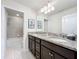 Bathroom boasts double sinks, granite countertops, and a shower/tub combo at 8914 Zurich Ln, Kissimmee, FL 34747