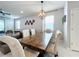 Elegant dining room with a large farmhouse table and seating at 8914 Zurich Ln, Kissimmee, FL 34747