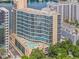 Aerial view of luxury high-rise building with pool at 322 E Central Blvd # 401, Orlando, FL 32801