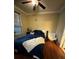 Comfortable bedroom with wood flooring and ceiling fan at 2045 Erving Cir # 101, Ocoee, FL 34761