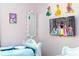 Charming bedroom with Disney princess decor and TV at 4326 Scene Ln, Kissimmee, FL 34746
