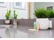 Bathroom vanity with grey countertop, double sinks and decorative plants at 4326 Scene Ln, Kissimmee, FL 34746