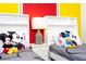 Twin bedroom with Mickey Mouse themed bedding and nightstand at 4326 Scene Ln, Kissimmee, FL 34746