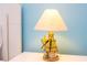 Unique bird lamp on white nightstand in bedroom at 4326 Scene Ln, Kissimmee, FL 34746