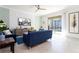 Gathering room features a large TV and sliding doors to the pool at 4326 Scene Ln, Kissimmee, FL 34746