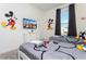 Mickey Mouse themed bedroom with twin beds and TV at 4326 Scene Ln, Kissimmee, FL 34746
