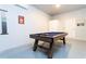 Pool table in a game room with white and blue walls at 4326 Scene Ln, Kissimmee, FL 34746