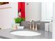 Clean bathroom with gray countertop and modern faucet at 4326 Scene Ln, Kissimmee, FL 34746