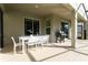 White patio furniture and grill near pool at 4326 Scene Ln, Kissimmee, FL 34746