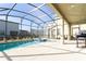Enclosed pool area with spa and grilling station at 4326 Scene Ln, Kissimmee, FL 34746