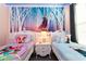 Twin beds in a princess-themed bedroom with Frozen mural at 4326 Scene Ln, Kissimmee, FL 34746