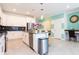 Modern kitchen with island, white cabinets and breakfast bar at 4326 Scene Ln, Kissimmee, FL 34746