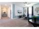 Living area with teal couch and 3D wall at 4326 Scene Ln, Kissimmee, FL 34746