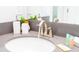 Stylish bathroom featuring a round sink, gray countertop and modern faucet at 4326 Scene Ln, Kissimmee, FL 34746