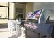 Outdoor patio with table, chairs, and grill at 4326 Scene Ln, Kissimmee, FL 34746