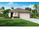 One-story home with stone accents and a two-car garage at 5575 Maddie Dr, Haines City, FL 33845