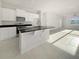 Modern kitchen featuring stainless steel appliances and a large island at 3744 Sagefield Dr, St Cloud, FL 34773