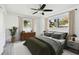 Spacious bedroom with a large bed and plenty of natural light at 1009 Loves Point Dr, Leesburg, FL 34748