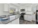 Renovated kitchen featuring modern appliances and granite countertops at 1009 Loves Point Dr, Leesburg, FL 34748