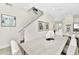 Bright dining area with a large table and access to the kitchen at 8103 Coconut Place, Kissimmee, FL 34747