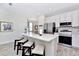 Modern kitchen with stainless steel appliances and white cabinets at 8103 Coconut Place, Kissimmee, FL 34747