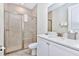 Clean bathroom featuring a shower, toilet and vanity with a quartz countertop at 8103 Coconut Place, Kissimmee, FL 34747