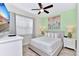 Bedroom with a queen bed, large artwork, and bedside tables at 8103 Coconut Place, Kissimmee, FL 34747