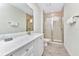 Clean bathroom with white vanity, shower, and toilet at 8103 Coconut Place, Kissimmee, FL 34747