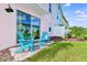 Small patio with teal adirondack chairs at 8103 Coconut Place, Kissimmee, FL 34747