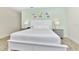 King bedroom with a white headboard and coastal-themed decor at 8103 Coconut Place, Kissimmee, FL 34747