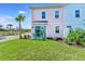Small patio with teal chairs and a sliding glass door at 8103 Coconut Place, Kissimmee, FL 34747