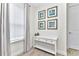 Entryway with white console table and coastal-themed wall art at 8103 Coconut Place, Kissimmee, FL 34747