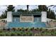 Twin Lakes community entrance with a beautiful fountain and landscaping at 4904 W Fountainwood Dr, St Cloud, FL 34772