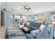 Comfortable living room with sectional sofa and view into kitchen at 4904 W Fountainwood Dr, St Cloud, FL 34772