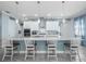 Modern kitchen with white cabinets, granite island, and stainless steel appliances at 4904 W Fountainwood Dr, St Cloud, FL 34772