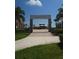 Emerson Plaza community entrance with stone pillars and paved pathway at 4904 W Fountainwood Dr, St Cloud, FL 34772