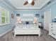 Main bedroom with king bed, and window seat at 4904 W Fountainwood Dr, St Cloud, FL 34772