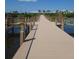 Community boardwalk leading to clubhouse with water views at 4904 W Fountainwood Dr, St Cloud, FL 34772